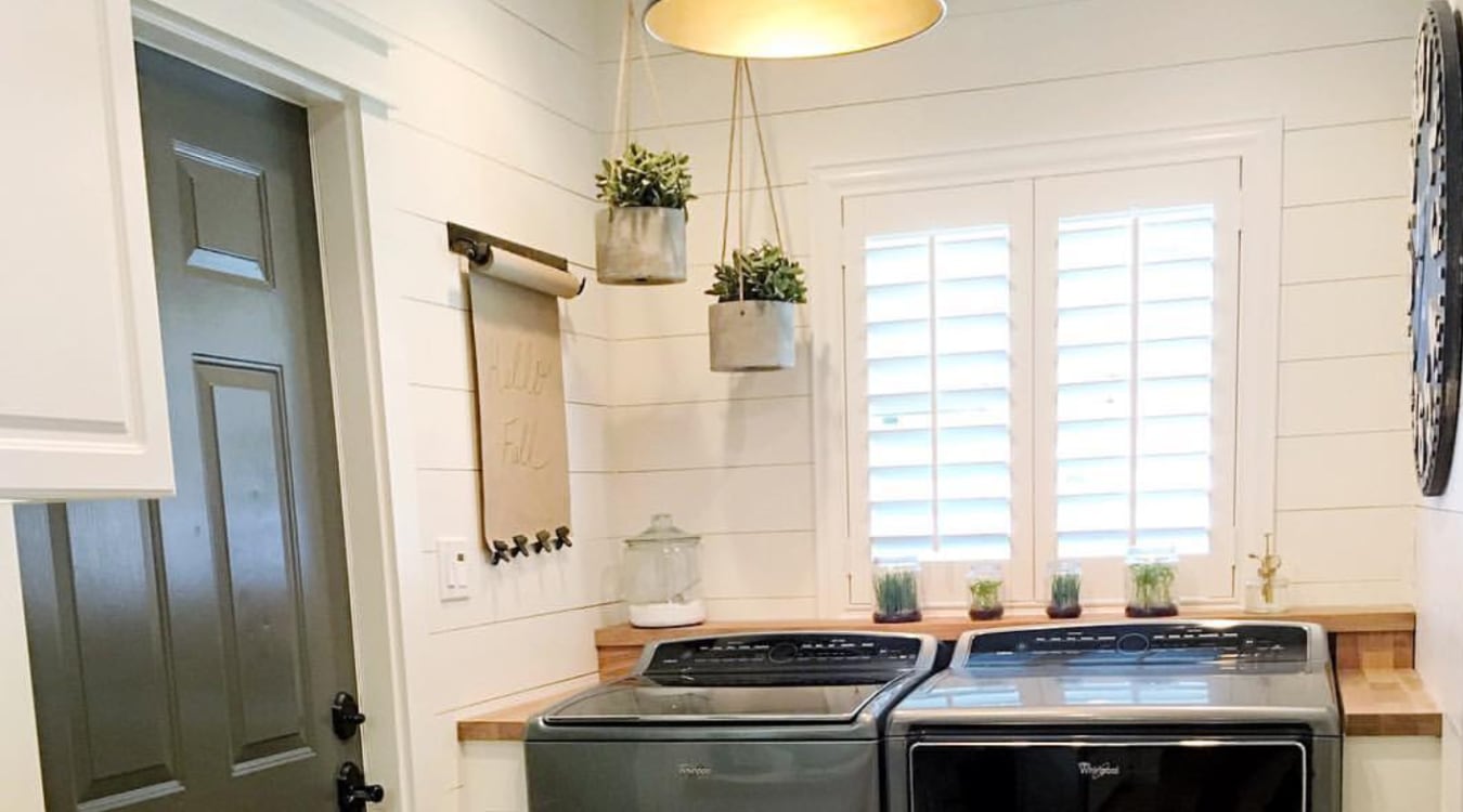 Laundry room with plantation shutters